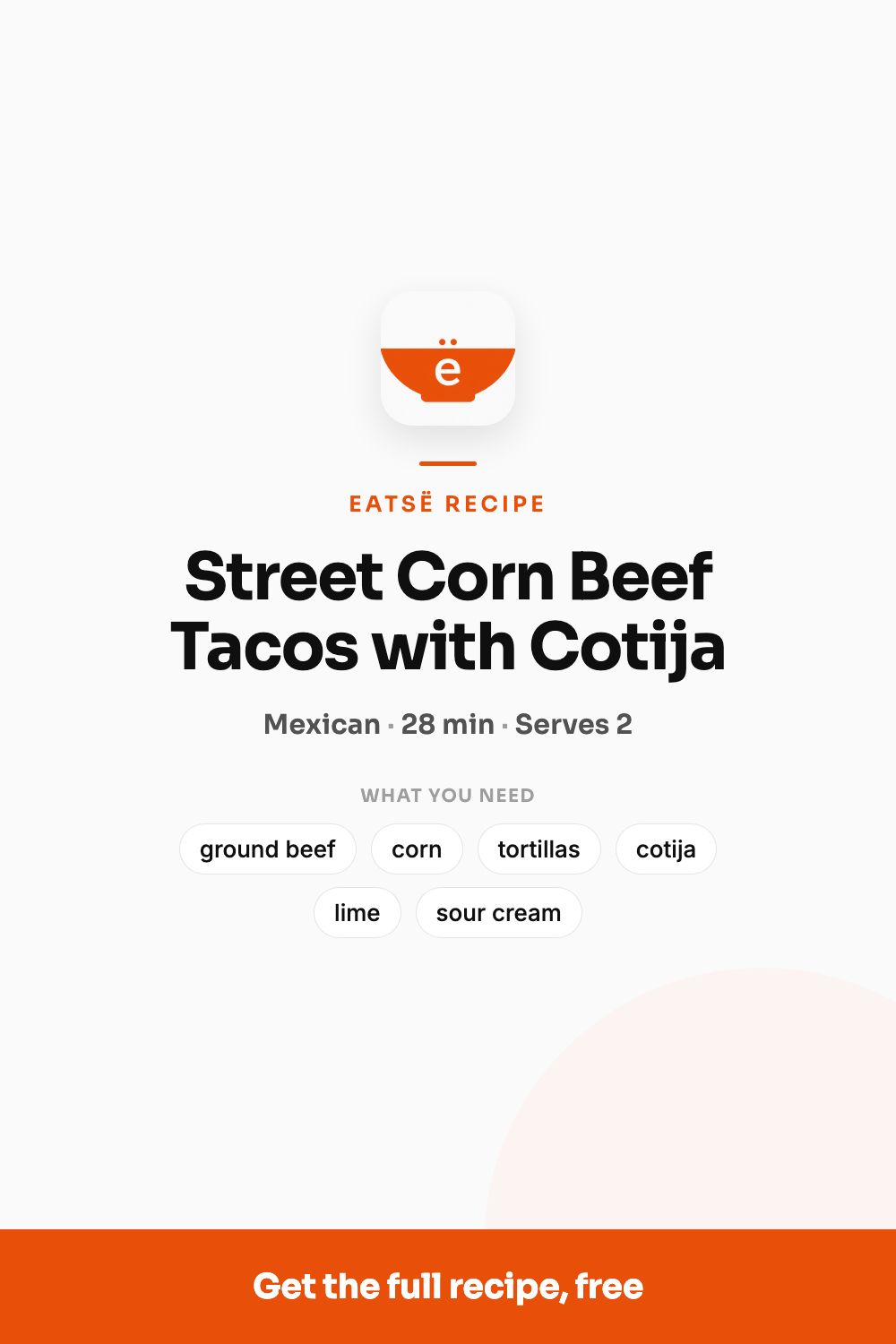 Two street corn beef tacos topped with cotija, cilantro, and lime crema on a plate
